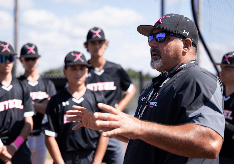 A baseball coach talking to his team.